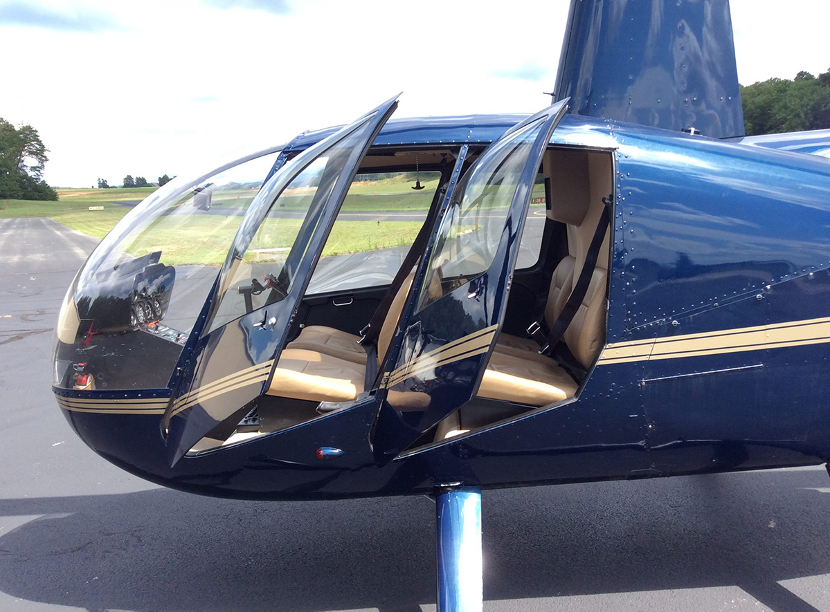 Side view of R44 Raven II Aircraft with the doors open